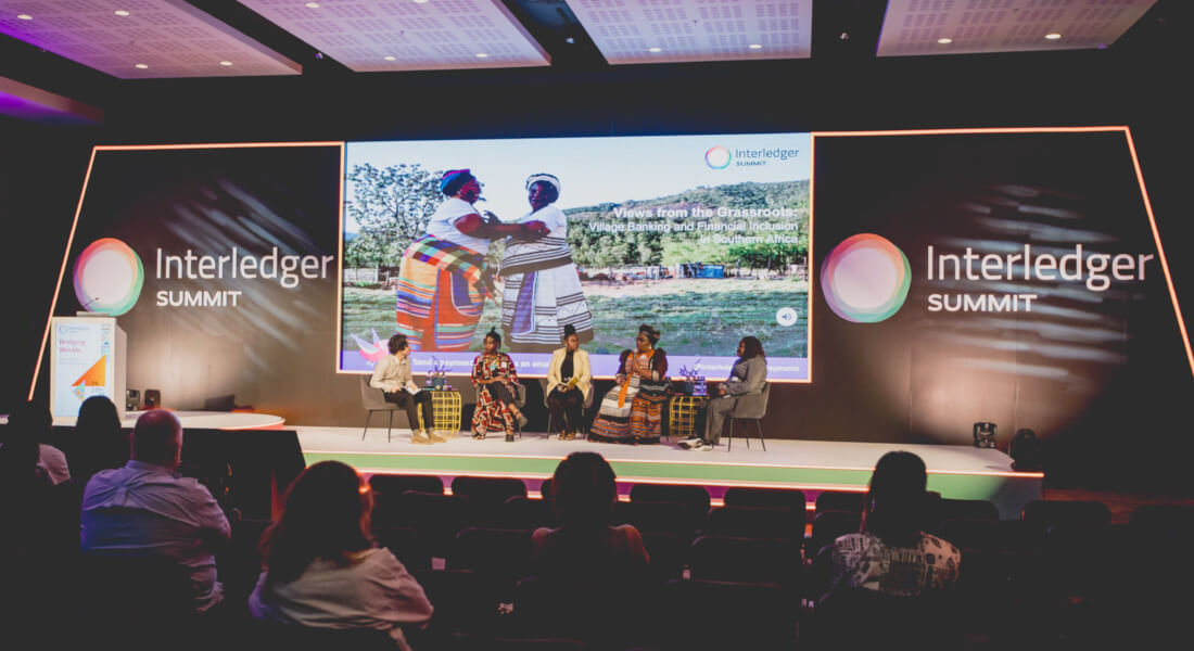 A photograph from the main stage of the 2024 Summit for a session about grassroots financial initiatives
